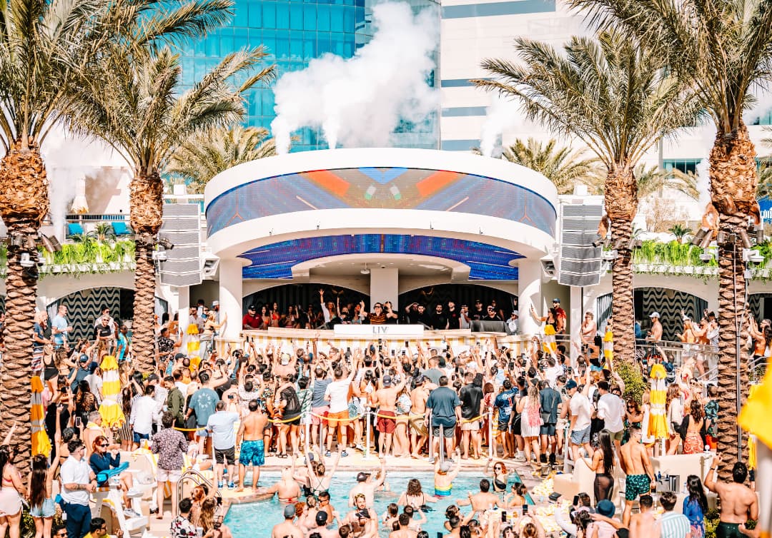 LIV Beach DJ booth in front of crowded pool
